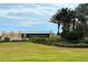 Sarasota National entrance sign with lush landscaping at 23619 Awabuki Dr, Venice, FL 34293
