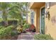 Inviting front entrance with landscaping and decorative wreath at 23619 Awabuki Dr, Venice, FL 34293