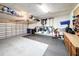 Organized garage with overhead storage and floor mats at 23619 Awabuki Dr, Venice, FL 34293