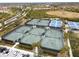 Expansive tennis courts with surrounding landscape at 23619 Awabuki Dr, Venice, FL 34293