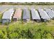 Aerial view of houses with backyard lanais and pools at 2751 Lavandula Ct, North Port, FL 34289