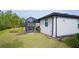 Home with backyard, screened patio, and well-manicured lawn at 2751 Lavandula Ct, North Port, FL 34289