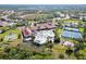 Aerial view of community with pools, tennis courts, and gardens at 2751 Lavandula Ct, North Port, FL 34289