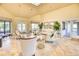 Community room with comfortable seating and large windows at 2751 Lavandula Ct, North Port, FL 34289