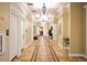 Elegant hallway with tiled floors and ornate lighting at 2751 Lavandula Ct, North Port, FL 34289