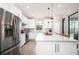 Modern kitchen with stainless steel appliances and an island at 2751 Lavandula Ct, North Port, FL 34289