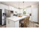 Modern kitchen with stainless steel appliances and white cabinetry at 2751 Lavandula Ct, North Port, FL 34289