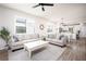 Living room with hardwood floors and view into kitchen area at 2751 Lavandula Ct, North Port, FL 34289