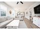 Open concept living room with hardwood floors and access to kitchen at 2751 Lavandula Ct, North Port, FL 34289