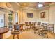 Community clubhouse lounge with comfortable seating and a TV at 2751 Lavandula Ct, North Port, FL 34289