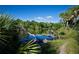 Peaceful nature trail alongside a tranquil waterway at 2751 Lavandula Ct, North Port, FL 34289
