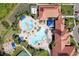 Resort-style pool with surrounding lounge chairs and landscaping at 2751 Lavandula Ct, North Port, FL 34289