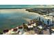 Aerial view of waterfront homes with red tile roofs and lush landscaping at 2985 N Beach Rd # C8-1, Englewood, FL 34223