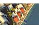 Bird's-eye view of property with red tile roofs near the water at 2985 N Beach Rd # C8-1, Englewood, FL 34223