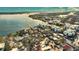 Aerial view of a waterfront community with a mix of house styles near the water at 2985 N Beach Rd # C8-1, Englewood, FL 34223