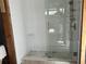 Modern bathroom with a large walk-in shower, new tile and glass enclosure at 2985 N Beach Rd # C8-1, Englewood, FL 34223