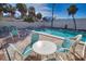 Inviting pool area with patio furniture at 2985 N Beach Rd # C8-1, Englewood, FL 34223