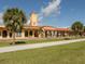 Quaint train station with palm trees and a grassy area at 405 Park N Blvd, Venice, FL 34285