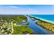 Aerial view of a tranquil waterway and beach at 4206 Vicenza Dr # C24, Venice, FL 34293