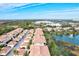 Aerial view of community, featuring a lake and a row of villas at 4206 Vicenza Dr # C24, Venice, FL 34293