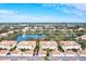 Aerial view of condo community with lake and lush landscaping at 4206 Vicenza Dr # C24, Venice, FL 34293