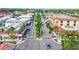 Aerial view of a town's streetscape with palm trees and buildings at 4206 Vicenza Dr # C24, Venice, FL 34293