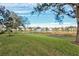 Community lake view from a lush backyard at 4206 Vicenza Dr # C24, Venice, FL 34293