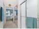 Bathroom with shower and mirrored closet at 4206 Vicenza Dr # C24, Venice, FL 34293
