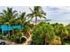 Beachfront restaurant with palm trees and ocean view at 4206 Vicenza Dr # C24, Venice, FL 34293