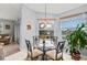Cozy breakfast nook with glass table and lake view at 4206 Vicenza Dr # C24, Venice, FL 34293