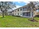 Two-story building with screened balconies and landscaped lawn at 4206 Vicenza Dr # C24, Venice, FL 34293