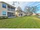 Building exterior showcasing a tranquil lake view at 4206 Vicenza Dr # C24, Venice, FL 34293