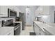 Modern kitchen with stainless steel appliances and ample counter space at 4206 Vicenza Dr # C24, Venice, FL 34293