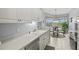Kitchen features white cabinets, stainless steel appliances, and a breakfast nook at 4206 Vicenza Dr # C24, Venice, FL 34293