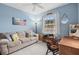 Home office with a comfortable couch and a desk at 4206 Vicenza Dr # C24, Venice, FL 34293