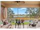 Spacious screened balcony with lake view and seating at 4206 Vicenza Dr # C24, Venice, FL 34293