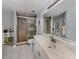 Bathroom features a walk-in shower and updated vanity at 4743 Butterfly Ln, North Port, FL 34288