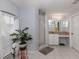 Bathroom with shower, vanity, and tiled floor at 4743 Butterfly Ln, North Port, FL 34288