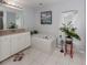 Spa-like bathroom with a garden tub and updated vanity at 4743 Butterfly Ln, North Port, FL 34288