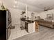 Open kitchen with granite countertops and breakfast bar at 4743 Butterfly Ln, North Port, FL 34288