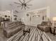Spacious living room with hardwood floors, recessed lighting, and comfortable seating at 4743 Butterfly Ln, North Port, FL 34288