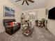 Cozy living room with a comfortable recliner and large window at 4743 Butterfly Ln, North Port, FL 34288