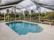 Inviting screened pool with ample space for relaxation at 4743 Butterfly Ln, North Port, FL 34288