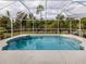 Screened-in pool with ample surrounding space at 4743 Butterfly Ln, North Port, FL 34288
