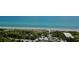 Aerial view of beach, parking, and ocean at 5055 N Beach Rd # 201, Englewood, FL 34223