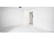 Empty bedroom with simple white walls and concrete floors at 5055 N Beach Rd # 201, Englewood, FL 34223