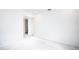 Empty bedroom with simple white walls and concrete floors at 5055 N Beach Rd # 201, Englewood, FL 34223