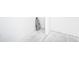 Empty corner of a room, showing unfinished flooring and walls at 5055 N Beach Rd # 201, Englewood, FL 34223