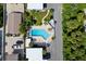 An aerial view of a community pool with surrounding patio furniture at 5055 N Beach Rd # 201, Englewood, FL 34223