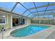 Inviting screened pool with ample patio space for relaxing and entertaining at 518 Boxwood Ln, Englewood, FL 34223